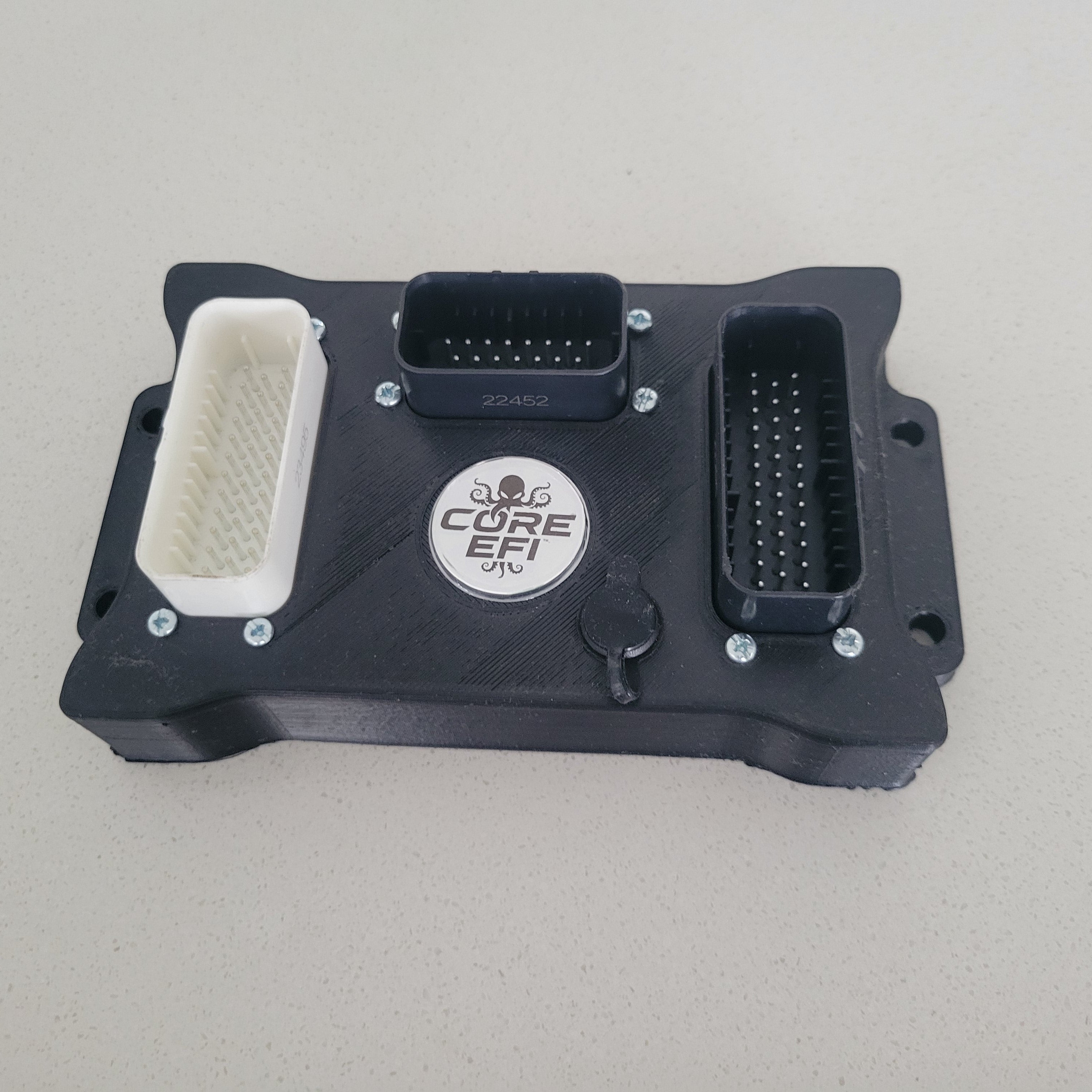 Race Core F7 in a black ABS enclosure with hexagonal badge and USB-C
